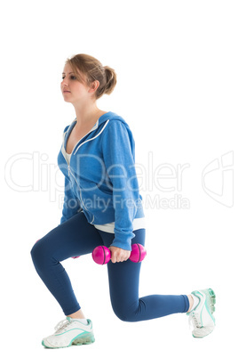 Young woman exercising with dumbbells