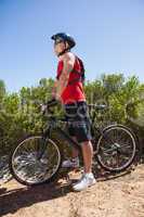 Fit man cycling on mountain trail