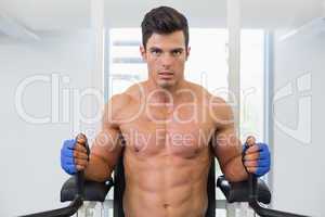 Muscular man doing crossfit fitness workout in gym