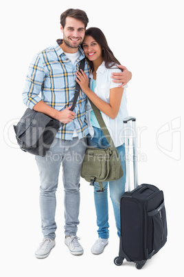 Attractive young couple going on their holidays