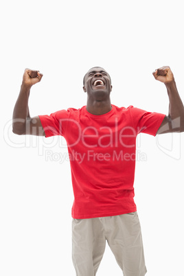 Football fan in red cheering