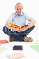 Mature student studying from notebook