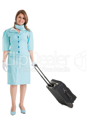 Portrait of stewardess in blue uniform with her bag