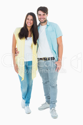 Happy casual couple smiling at camera