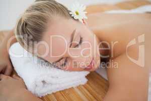Beautiful blonde relaxing on massage table