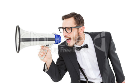 Geeky businessman shouting through megaphone