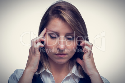 Close up of beautiful young businesswoman with headache