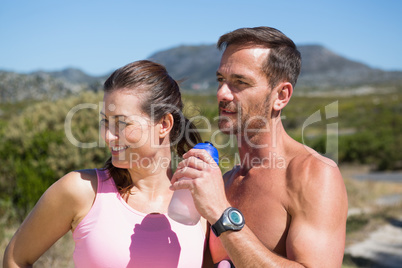 Active couple jogging in the countryside