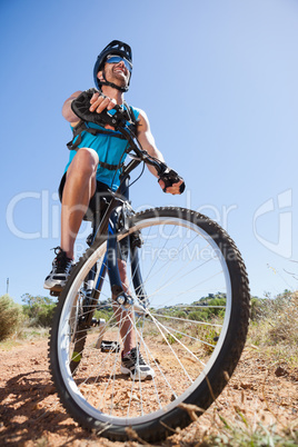 Fit cyclist riding in the countryside