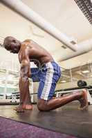 Shirtless muscular man at gym