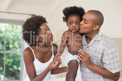 Happy parents with their baby girl