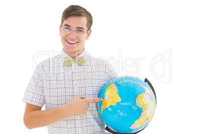 Geeky hipster holding a globe smiling at camera