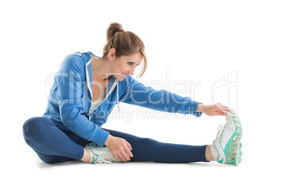 Young woman touching hand to leg