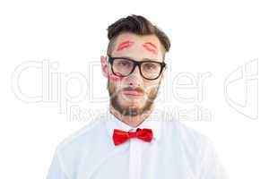 Geeky hipster with kisses on his face