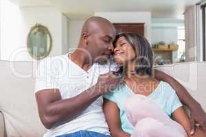 Happy couple relaxing on the couch