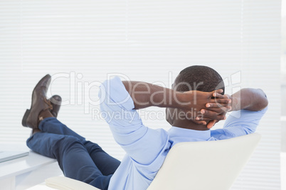 Relaxed businessman with his feet up