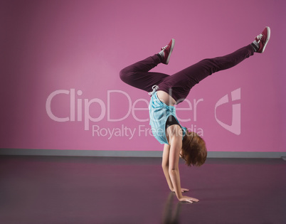 Pretty break dancer doing a handstand
