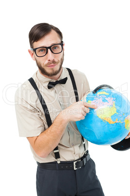 Geeky hipster pointing to globe