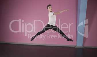 Focused male ballet dancer leaping