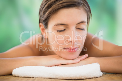 Beautiful young woman on massage table