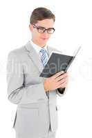 Geeky businessman reading black book