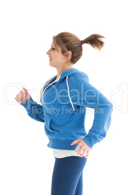 Side view of a young woman running