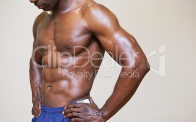 Close-up mid section of a shirtless muscular man