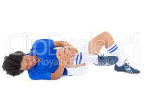 Football player in blue lying injured