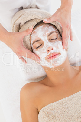 Attractive woman receiving treatment at spa center