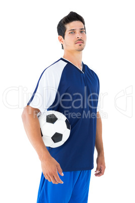 Football player in blue holding the ball