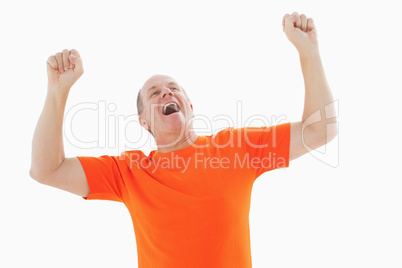 Mature man in orange tshirt cheering