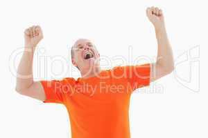 Mature man in orange tshirt cheering
