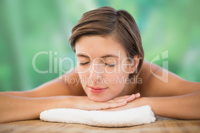 Beautiful young woman on massage table