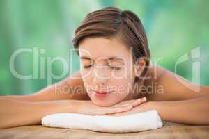 Beautiful young woman on massage table