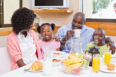 Happy family having breakfast together in the morning