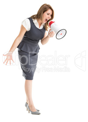 Young businesswoman shouting into bullhorn
