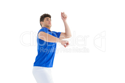 Football player in blue jersey jumping