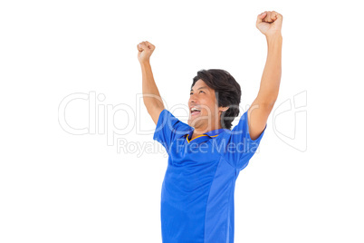 Football player in blue celebrating a victory