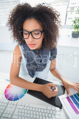 Pretty designer working at her desk