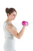 Young woman exercising with dumbbell