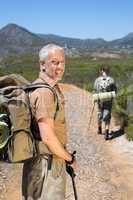 Hiking couple walking on mountain trail