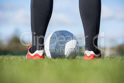 Football player standing with the ball