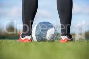 Football player standing with the ball