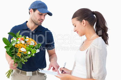 Happy flower delivery man with customer