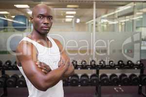 Serious muscular man in gym