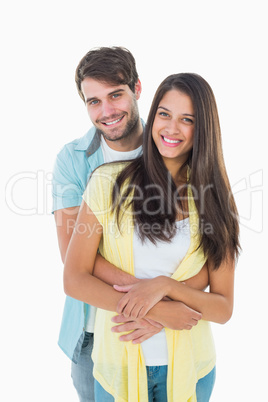 Happy casual couple smiling at camera Happy casual couple smiling at camera