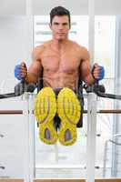 Muscular man doing crossfit fitness workout in gym