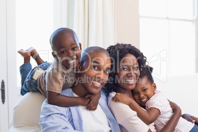 Happy family posing on the couch together