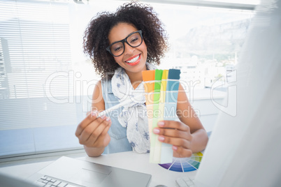 Pretty designer working at her desk Pretty designer working at her desk