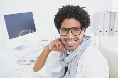 Hipster businessman working at his desk